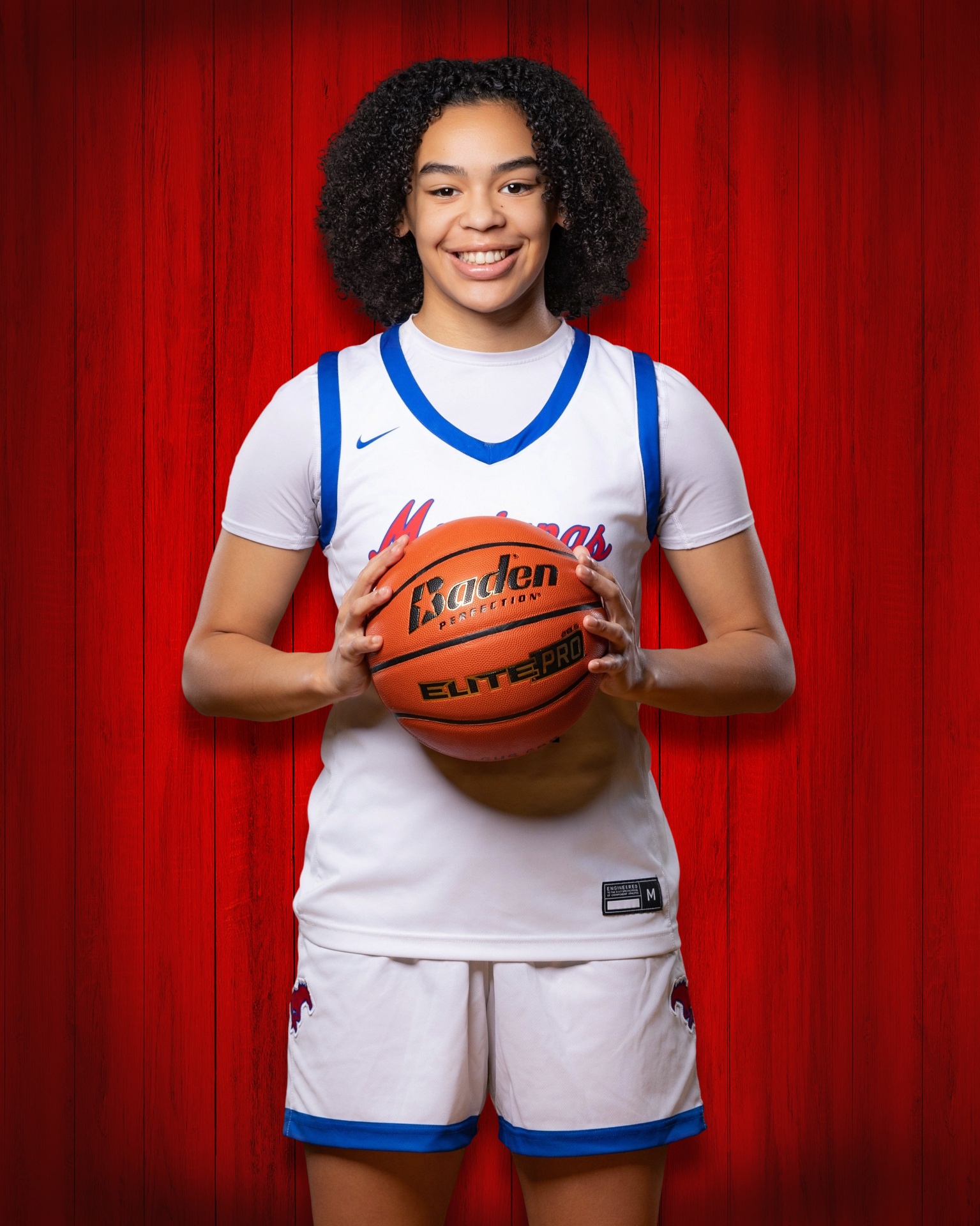 Adia Stull driving the basketball court